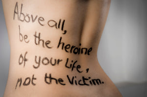Above All Be The Heroine Of Your Life Not The Victim Written On A Woman's Body On The Back