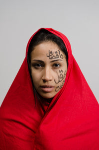 Fierce Arab Woman Looking Into Camera Expressing Pain & Strength Supporting Feminism